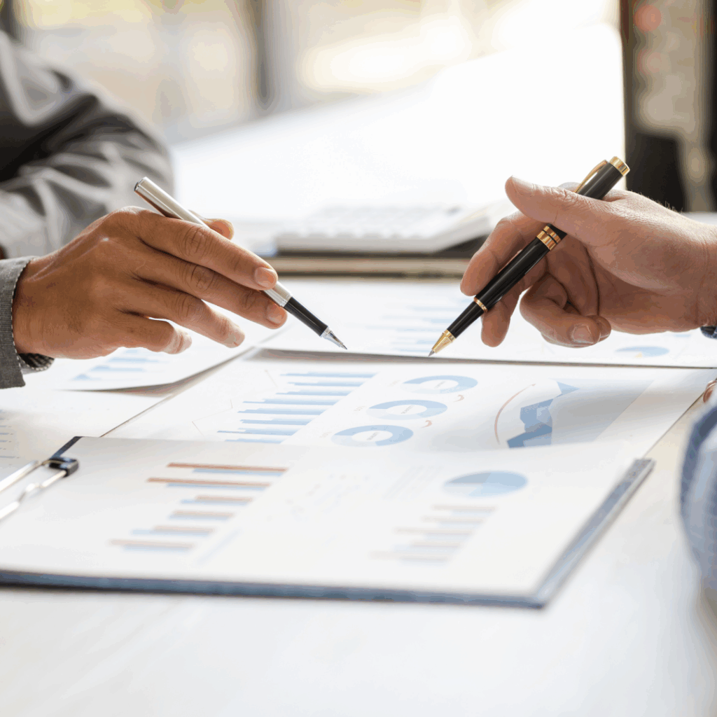 Two people going over numbers | Indianapolis commercial real estate development advisory