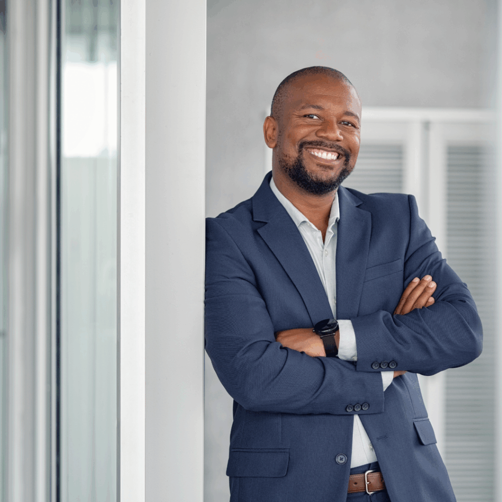 Man leaning again wall | commercial real estate services in Indianapolis |Indianapolis commercial landlord and tenant representation