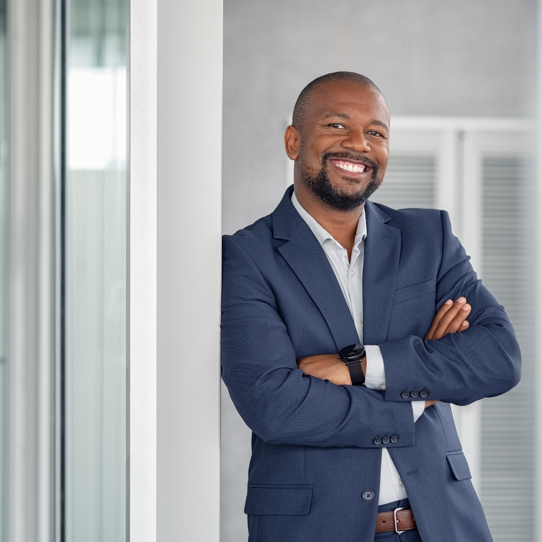 Man leaning again wall | commercial real estate services in Indianapolis |Indianapolis commercial landlord and tenant representation